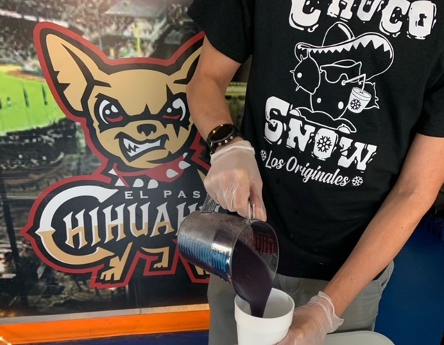 adult slushie being poured into a cup